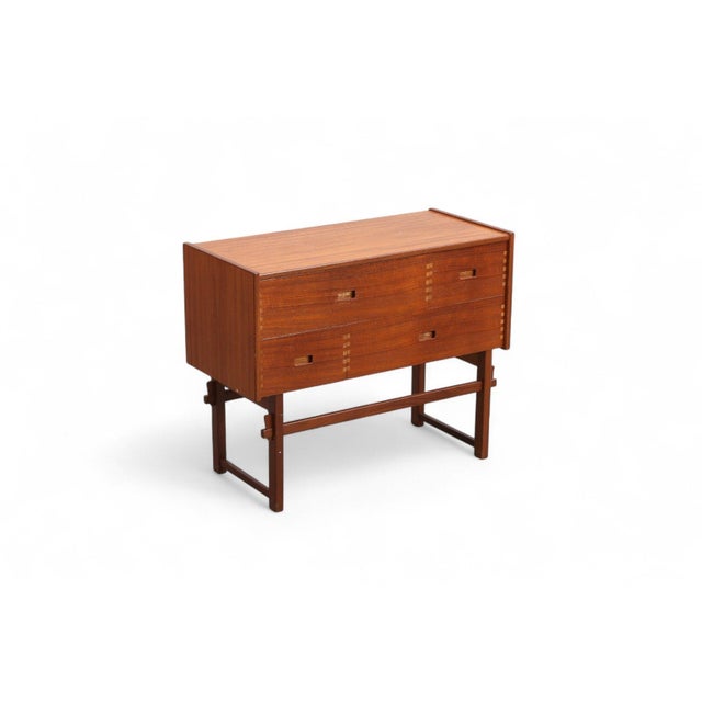 Origin: Denmark Designer: Unknown Manufacturer: Unknown Era: 1960s Materials: Teak Measurements: 29.5″ wide x 13.75″ deep...