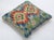 A one-of-a-kind handwoven Afghan wool kilim accent pillow featuring twin diamond medallions on cream. Cut and sewn by hand...