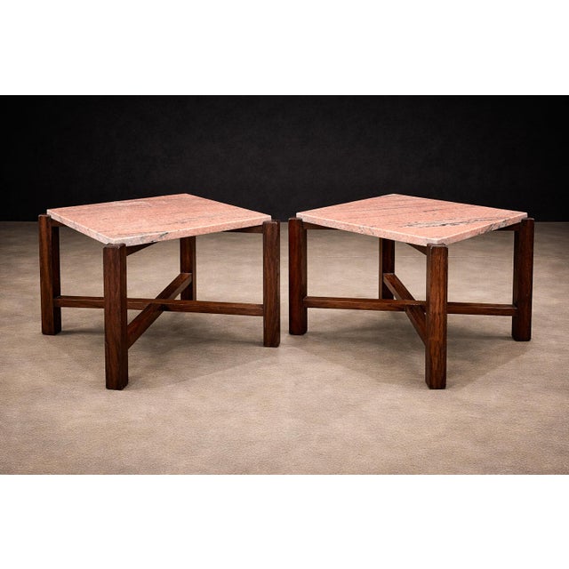 A compelling study in material contrast and architectural clarity, this pair of Brazilian side tables from the 1960s...