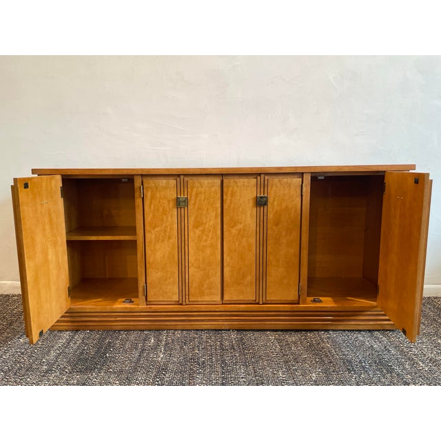 It has a handsome architectural presence and a warm, honey-toned wood finish. The beautifully figured veneer gives the...