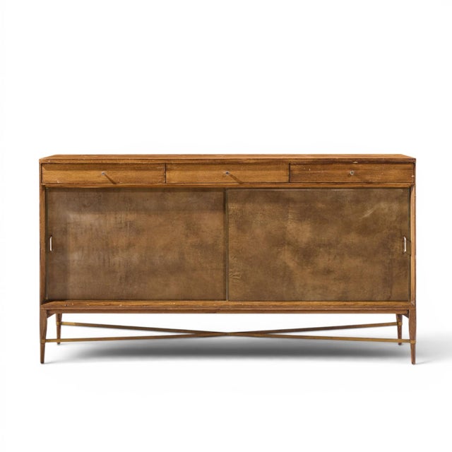 Paul McCobb for Calvin Mid Century Mahogany and Brass Credenza This credenza measures: 66 wide x 19.25 deep x 36.25 inches...