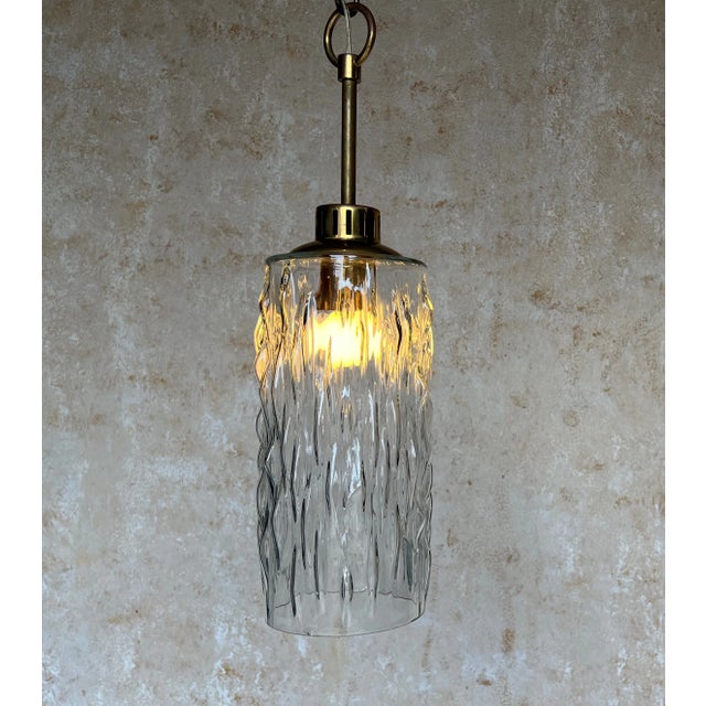 This hanging light fixture from 1960s France is a beautiful and unique piece of vintage lighting design. The textured...