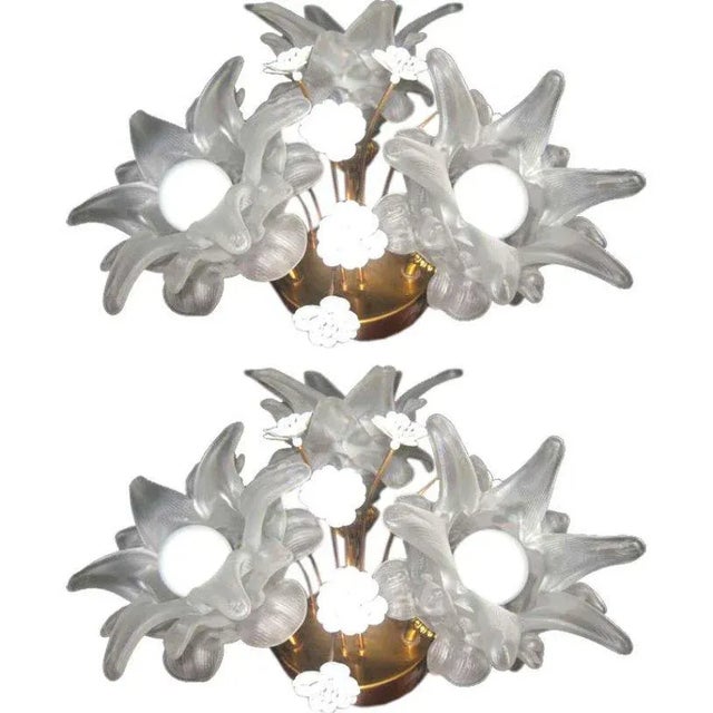 This pair of flower sconces is made from brass and glass. European Plug (up to 250V).The wiring of this item may be...