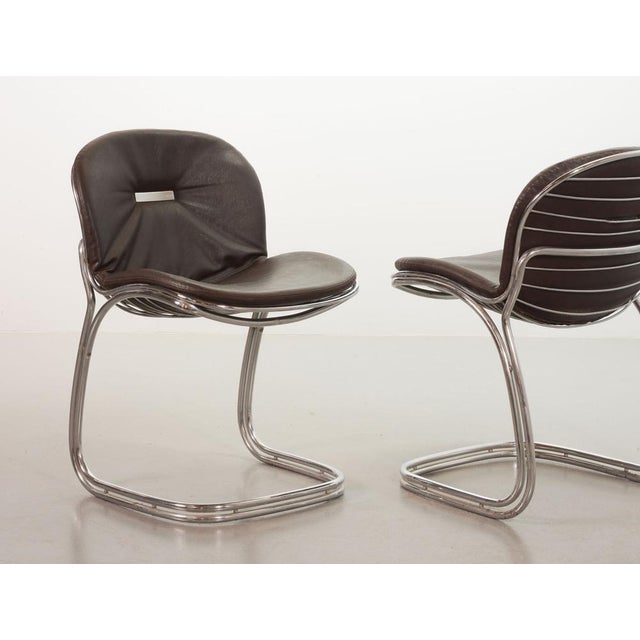 Set of two steel tubular/wire dining chairs 'Sabrina' by the Italian designer Gastone Rinaldi for Rima. Manufactured in...