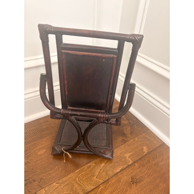 Dark stained bamboo with rattan corners. Mirror tilts. Woven base.