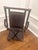 Dark stained bamboo with rattan corners. Mirror tilts. Woven base.