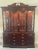 1998 Knob Creek Breakfront China cabinet with three lights and curved glass in doors. Dark finish not cherry finish. Could...