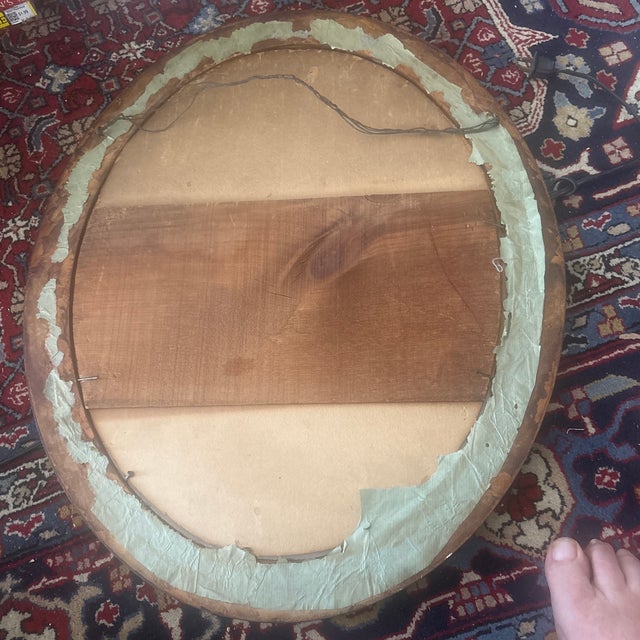 This is a wonderful four piece segmented oval wooden frame that measures 23 3/4”H x 19 3/4”W with a curved 2-inch width....
