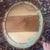 This is a wonderful four piece segmented oval wooden frame that measures 23 3/4”H x 19 3/4”W with a curved 2-inch width....