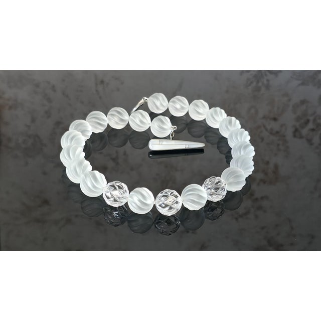 Genuine Swirl-Carved Frosted Rock Crystal Beaded Necklace with Mother-of-Pearl Toggle Clasp A striking and elegant...