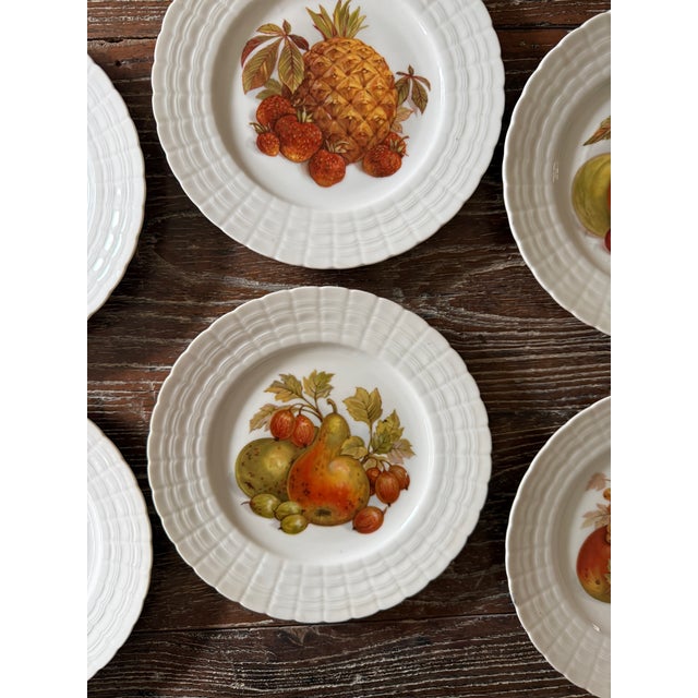 Beautiful set of six vintage Hutschenreuther German porcelain salad or dessert plates, each featuring a different richly...
