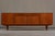 A vintage Danish teak sideboard from Denmark, 1970's. The producer and designer are unknown. Crafted from warm teak wood,...