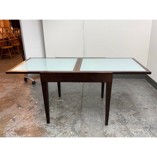 Design Plus Gallery presents a Five Piece Extendable Dining Set. The set includes one dining table, two armchairs, and...