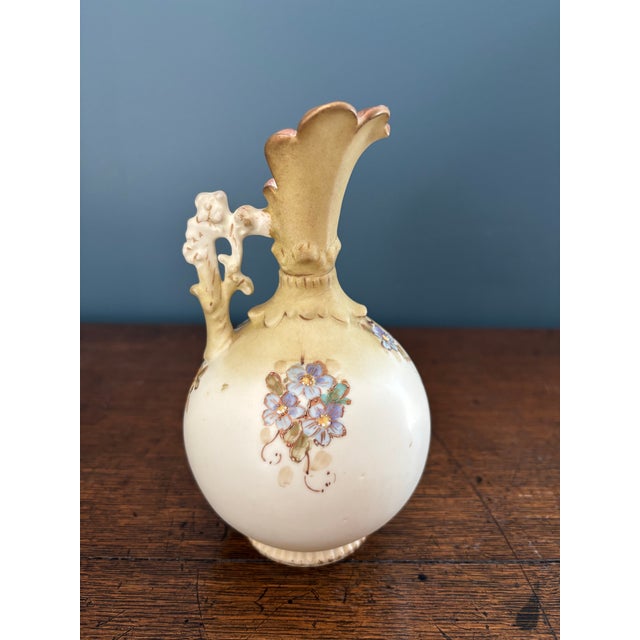 Description: Add a touch of turn-of-the-century Bohemian elegance to your shelf styling or porcelain collection with this...
