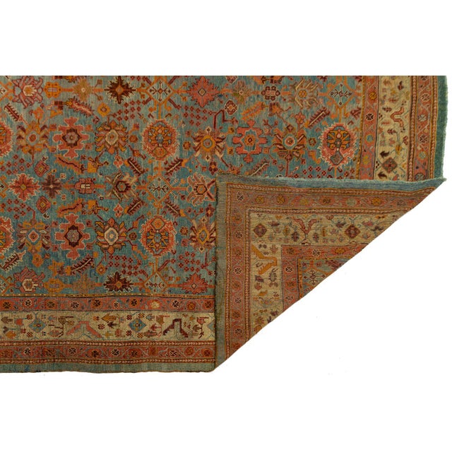 This exceptional Antique Oushak rug is a masterpiece of late 19th Turkish craftsmanship. Featuring a sophisticated and...