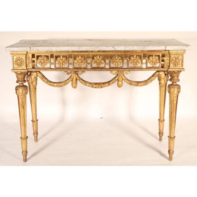 Antique Continental Louis XVI style gilt wood (gold leaf) console table with a white Carrara marble top, late 19th...