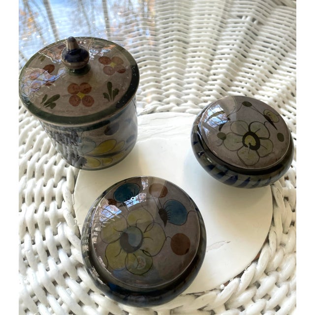 This lovely 3 piece set of containers includes a cylinder form covered dish with a finial top (4.5" H), and two small...