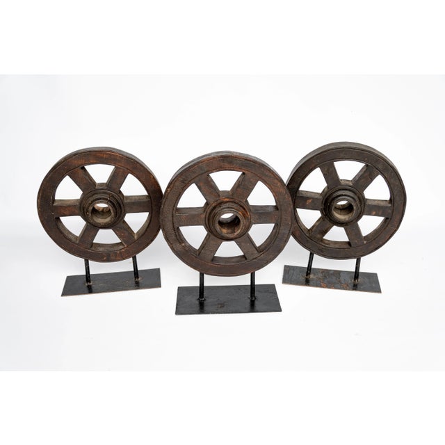 Our wood wheels are 12 inches diameter with six spokes. Dark finish with a low profile iron base. A great accent piece for...