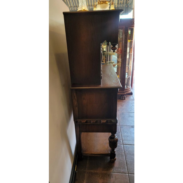 A nice Antique oak Hutch. This is Tudor or could go Spanish Revival as well as Traditional English. The overall design is...