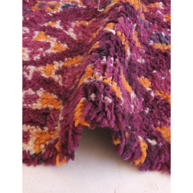 This vintage Moroccan rug showcases exquisite Amazigh craftsmanship with a dense lattice of diamond and lozenge motifs...