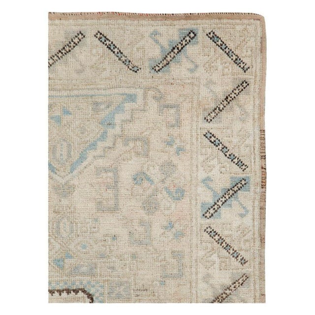 A vintage Turkish Anatolian throw rug handmade during the mid-20th century. Measures: 3' 11" x 5' 10".