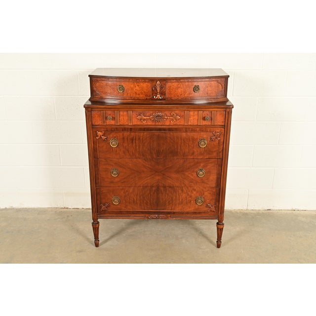 An exceptional French Regency Louis XVI style highboy dresser or chest of drawers By Simmons Furniture USA, Circa 1930s...