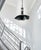 This one‑of‑a‑kind mixed‑media pendant light stands 23 inches tall (excluding the chain) with a sculptural shade measuring...