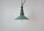 Industrial petrol enamel pendant light made in Poland during the 1960s. White enamel inside the shade. Green cast...