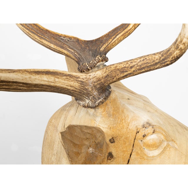 A life-size sculpture of a stag from the mid 20th century with antlers and natural patina. Hand-carved during the...