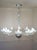 A large Murano blown glass chandelier, characterized by the refined etched glass workmanship that gives the crystal a...