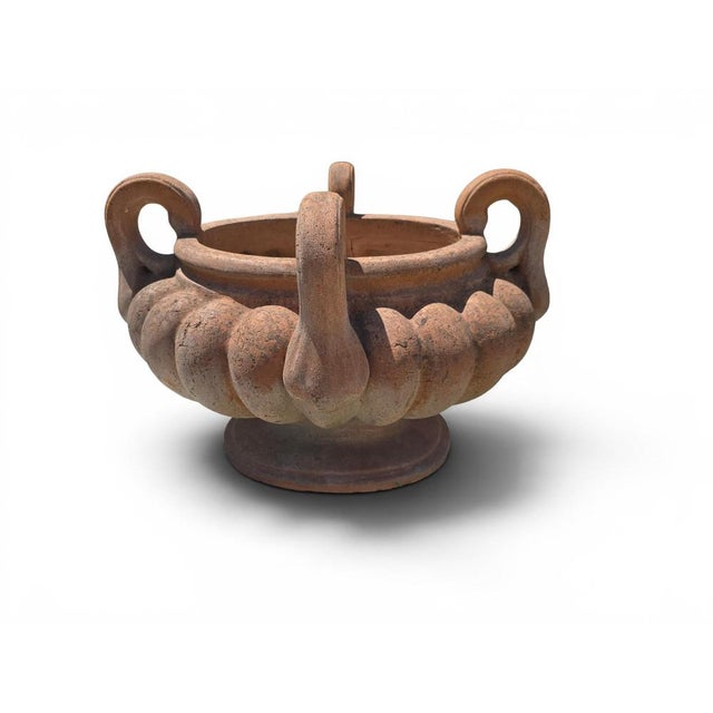 Impressive Italian terracotta krater dating from the mid-20th century, distinguished by its elegant lobed body and four...