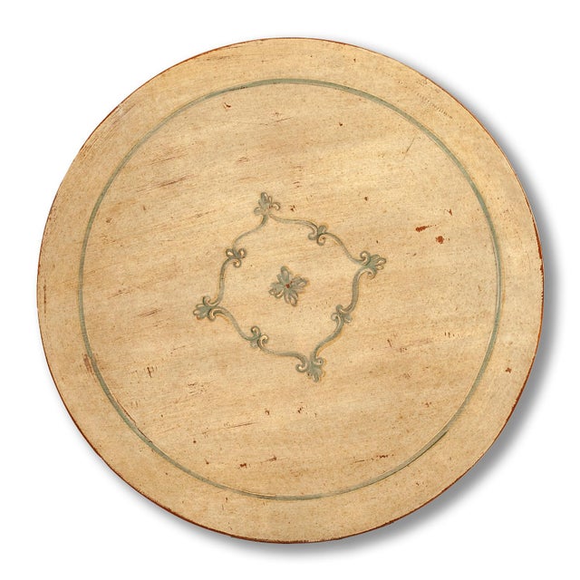 Handcrafted in Italy, this round side table features a hand-painted top with a floral medallion and decorative border in...