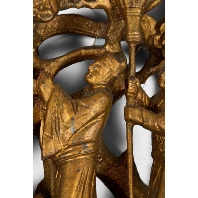 Pair antique Chinese deeply carved wood openwork giltwood architectural panels, depicting intricate scenes illustrating...
