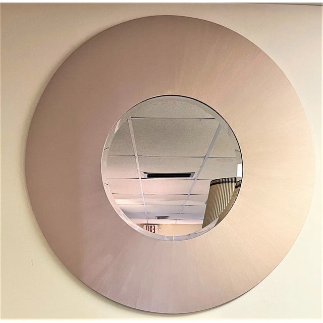 A magnificent monumental mid century modern round wall mirror from the 1970's. It is made of wood with a ribbed painted...