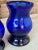 These exquisite vintage cobalt blue vases, crafted from hand-blown glass, showcase a deep, vibrant hue that adds a touch...