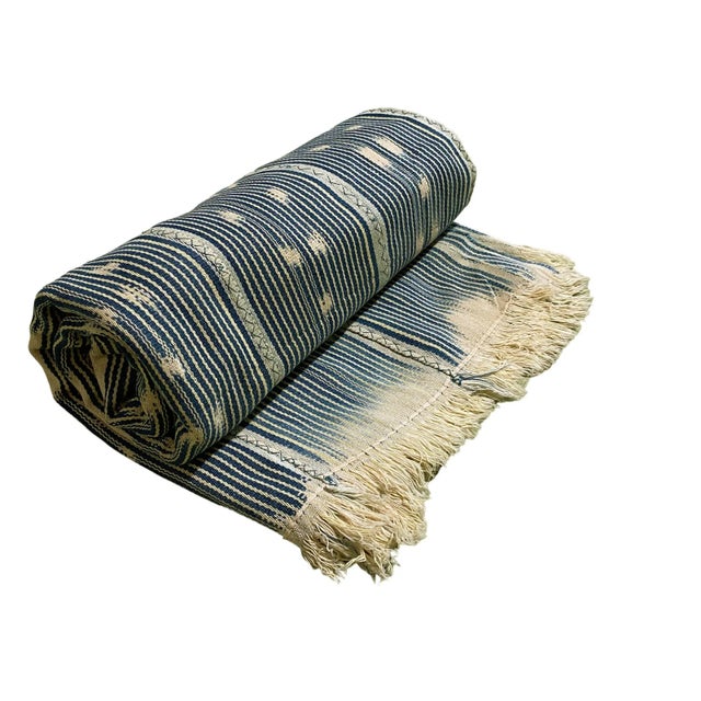 This vintage Baule cloth from Côte d’Ivoire was traditionally worn as a wrap by women of the Baoulé tribe. Crafted from...