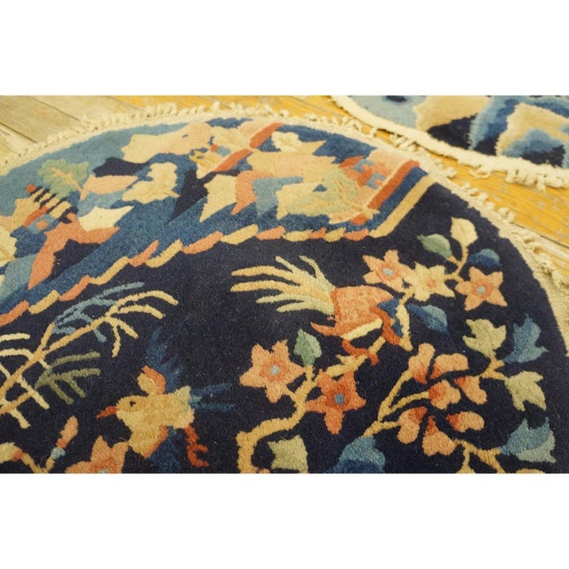 Antique Chinese - Peking Chinese Floral Blue 1920s Rug, Circa Date: 1920s. This exceptional round piece exemplifies the...