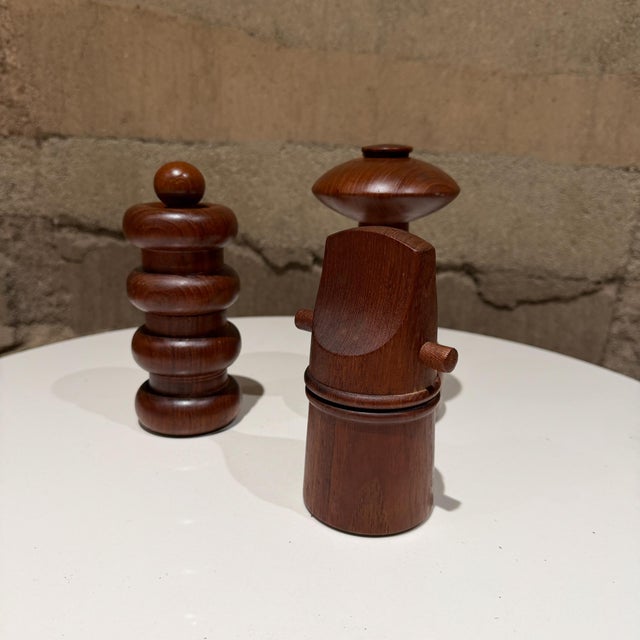 For your consideration, a vintage set of three pepper mills designed by Jens Quistgaard for DANSK. Constructed with teak...