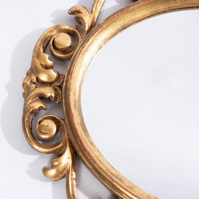 Carved Italian giltwood mirror, intricately cut frame. Bright and stands out in any setting.