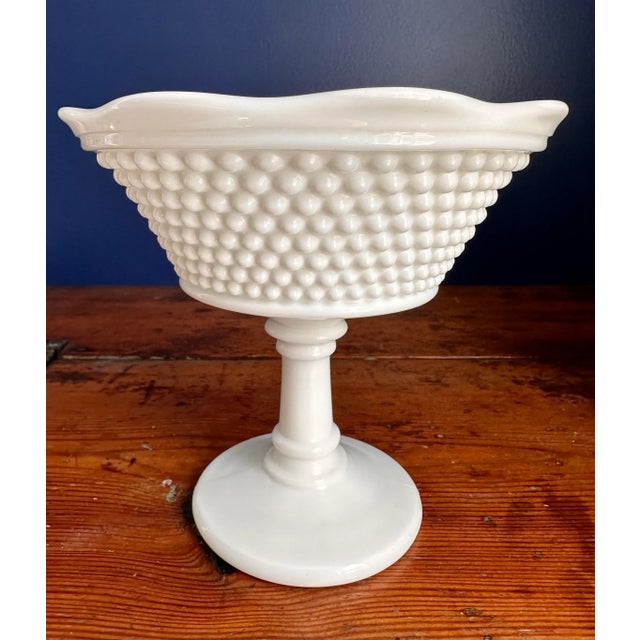 American bell style hobnail milk glass compote. Made by Westmoreland, this vintage pedestal bowl is a classic.