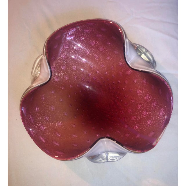 Decorative Blown Italian footed Glass Bowl. Beautiful pink belly with white outer. Great table top accent or use as...