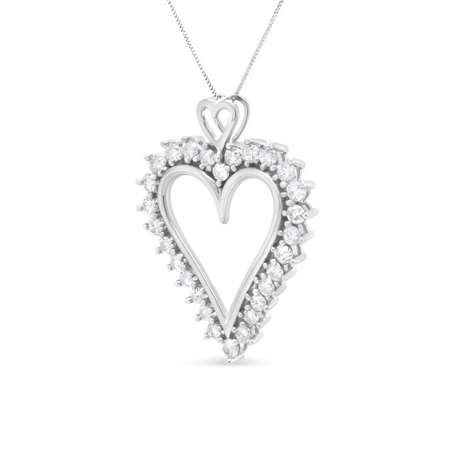 This ravishing .925 sterling silver necklace is a true romantic, shaped in an openwork heart and studded with round...