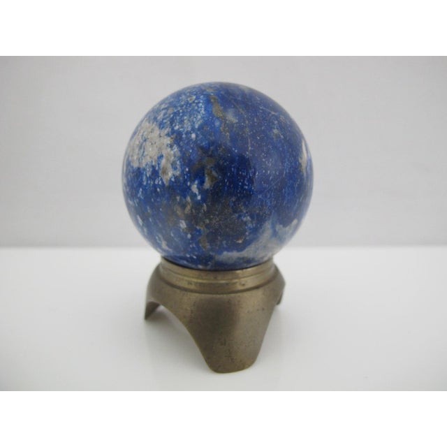 Small Lapis Lazuli quartz crystal sphere with brass stand. A decorative gemstone ball, polished from natural stone...