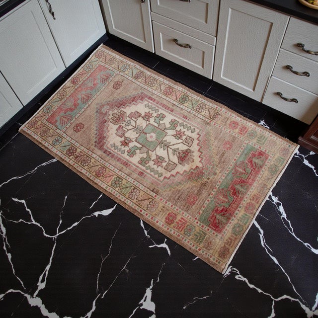 Welcome to our curated collection of authentic Anatolian textiles. This exquisite vintage Oushak piece brings timeless...