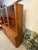 This 1970s Danish modern teak wall unit was made by Dyrlund and features their signature thick solid wood trim profile....