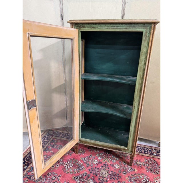 Venetian Painted Wooden Display Cabinet Three glass sides Decorated with ribboned foliage Spindle legs