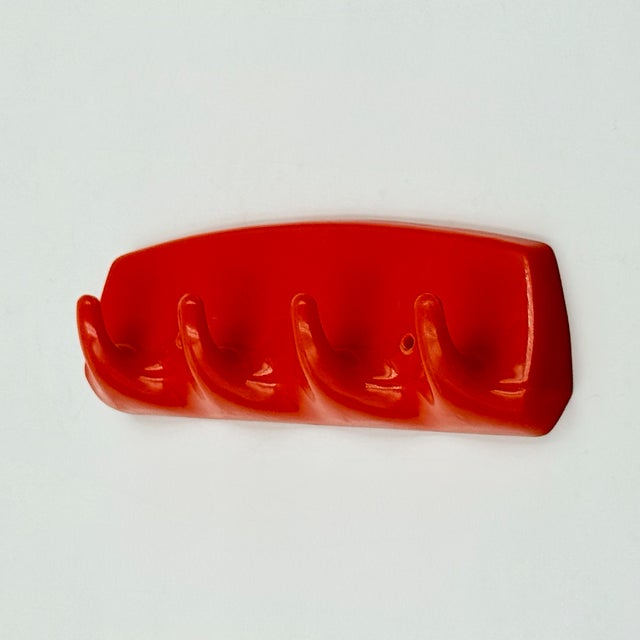Compact and highly graphic wall hooks produced by gilac in france during the 1970s. the piece is made entirely of glossy...