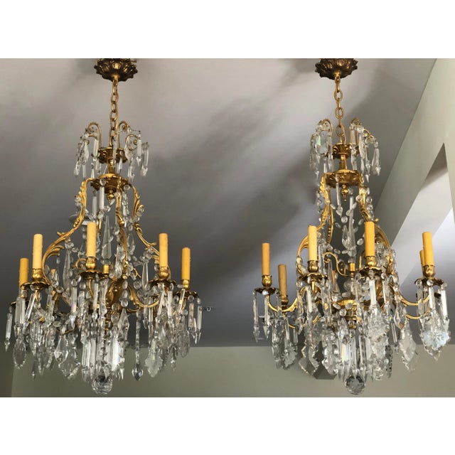 Magnificent pair of late 19th century French gilt bronze and cut crystal chandeliers, executed in the Louis XV (Rococo)...