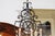 Early 20th Century French 12-Light Wrought-Iron Chandelier with Clock Motif and Scrolling Armature For Sale - Image 11 of 12