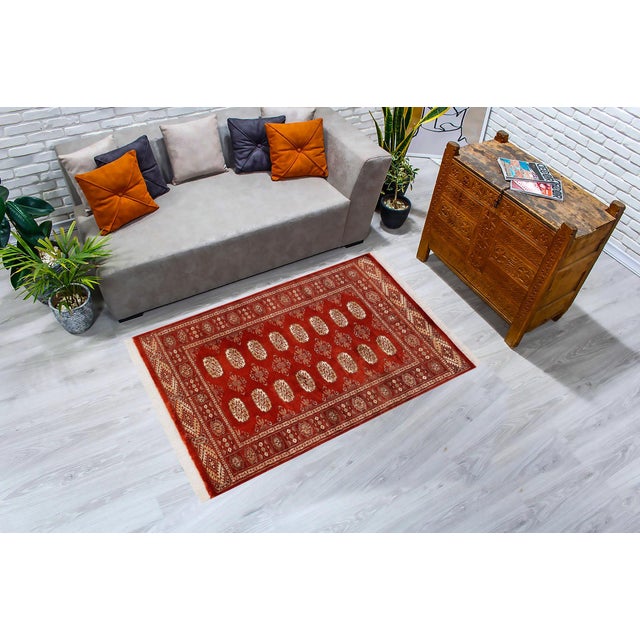 Transform the interior of your home with a beautiful hand-knotted Bokhara rug. Meticulously crafted with intricate...